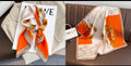 Foulard satiné imprimé feuilles de ginkgo orange